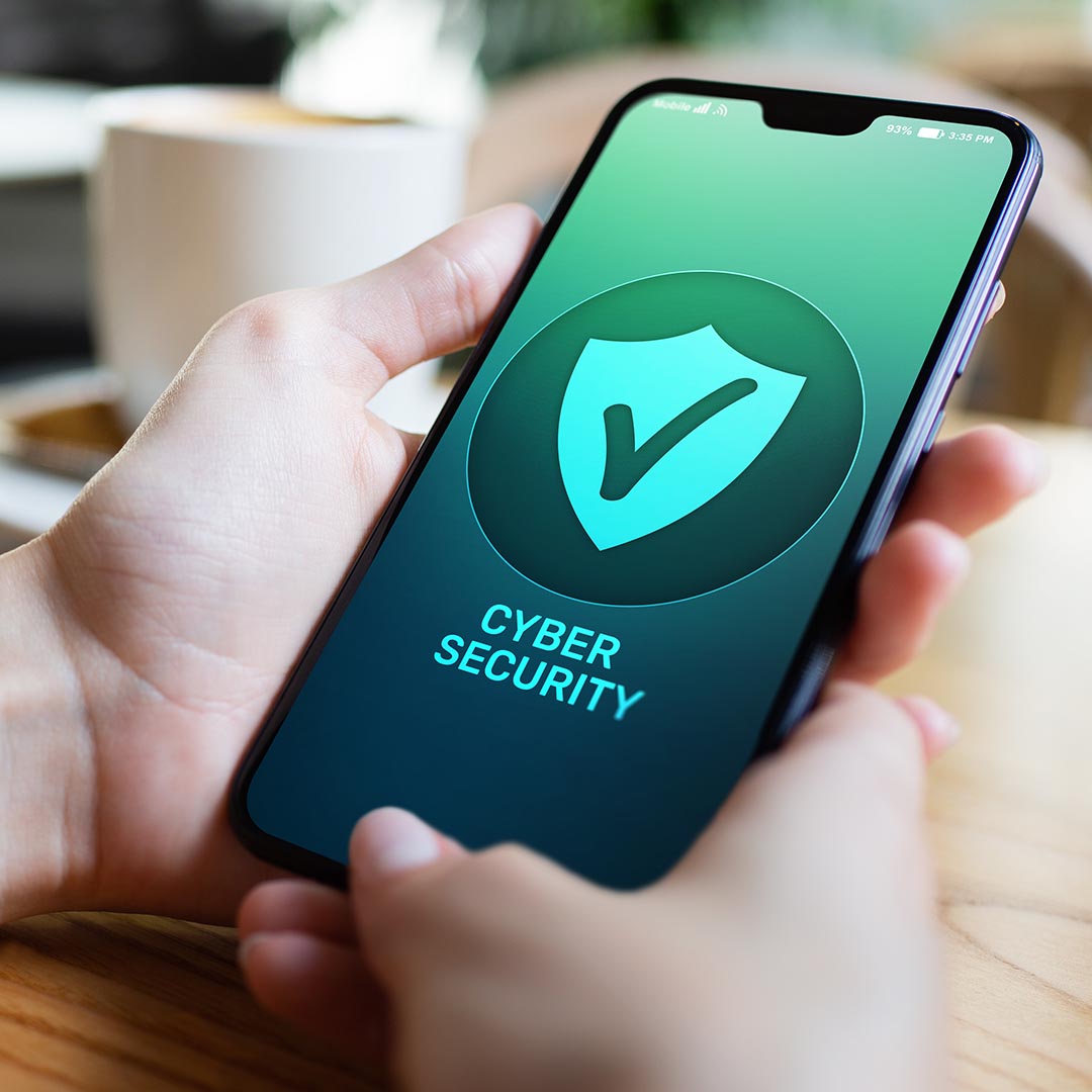 person holding a phone that has Cyber Security on the screen