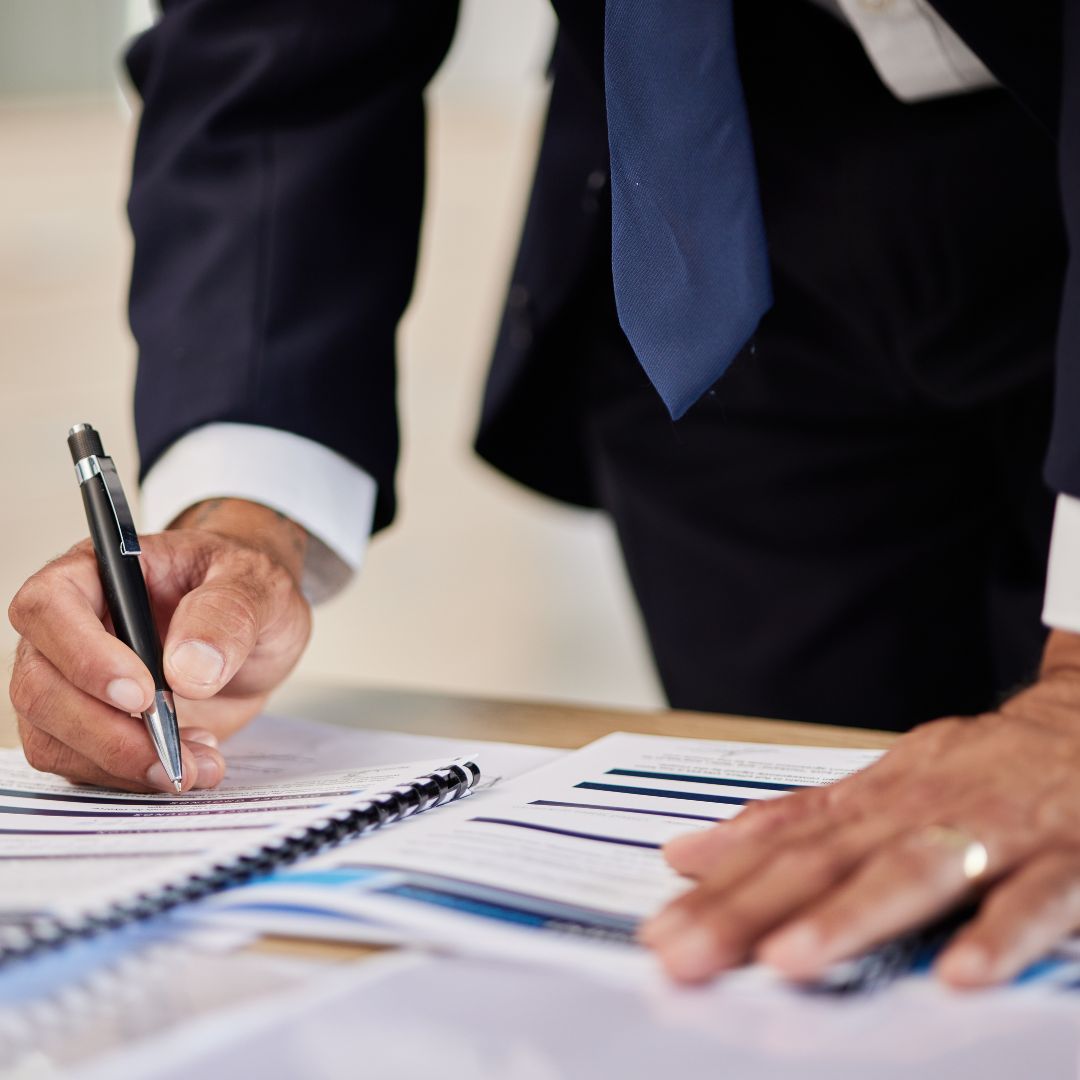 businessman looking over paperwork