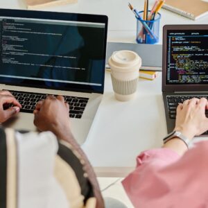 Two workers completing code