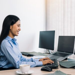 A woman sitting at a computer